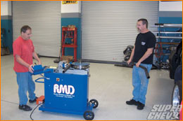 Tim and Denny Steward use an RMD CNC tube bender to make the main hoop. Tim isn't happy until the hoop fits with perfect clearances on all sides